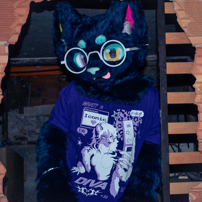 A black furry character wearing round white-framed glasses and a purple graphic T-shirt, posed in front of a dark doorway with brick-like framing.